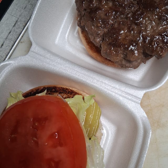 Hamburger lett, tomatoes, mayo, mustard, ketchup, onions, pickles.